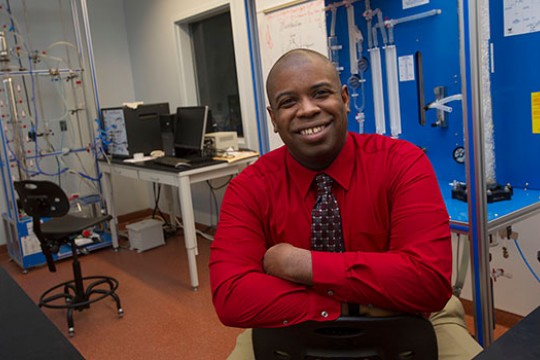 Reginald Rogers poses for a photo in his lab.