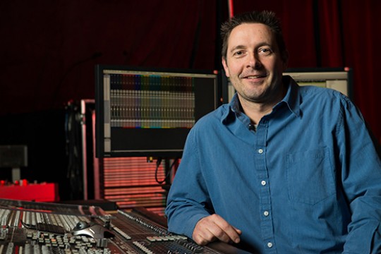 Engineer posing in sound booth