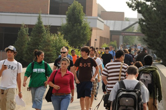 Students walking across bridge
