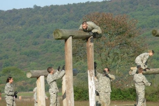 People climbing obstacles