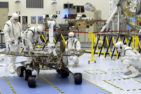 People working on rover in lab