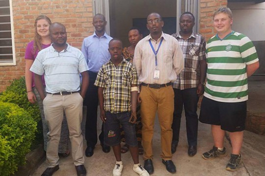 Family and Students Posing outside building enterance