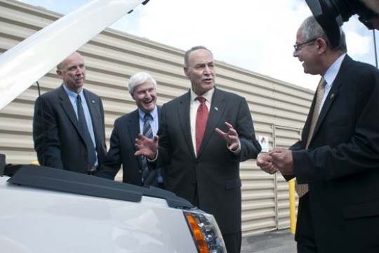 People talking around car