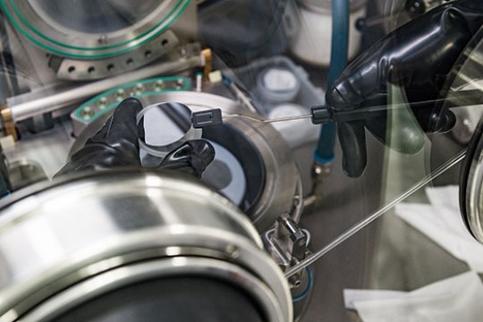 An up-close photo of someone handling microsystems technology.