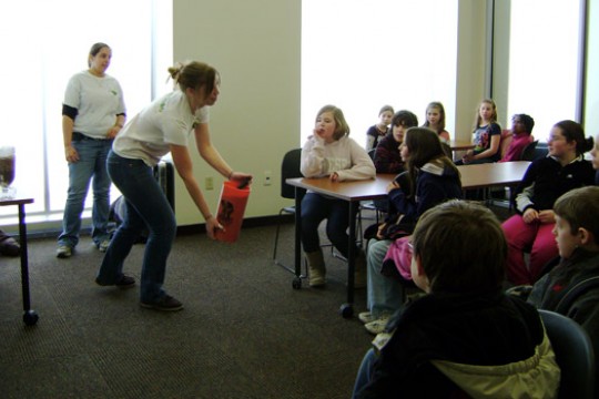 Person teaching kids