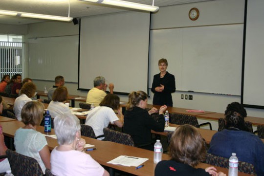 Professor teaching in front of classroom