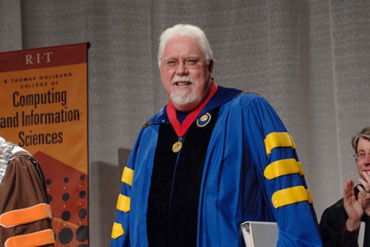 Professor speaking on stage for graduation