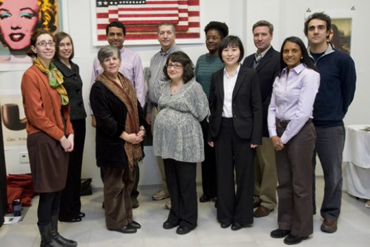 People posing for camera at event