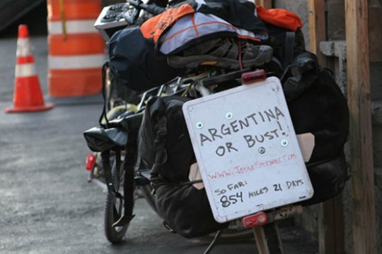Picture of bike with "Argentina or Bust!" sign
