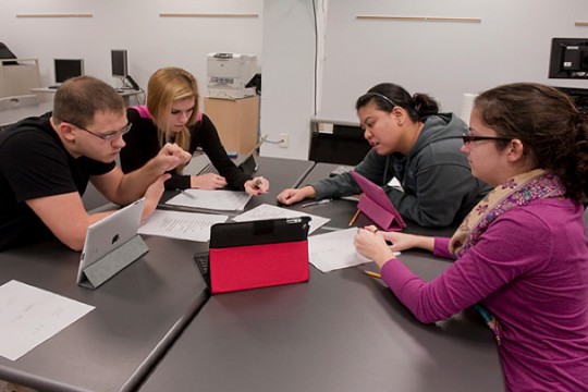 People working on problem in classroom
