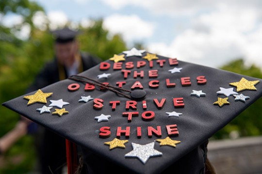 Picture of Graduate cap displaying "Despite the Obstacles Strive to Shine"