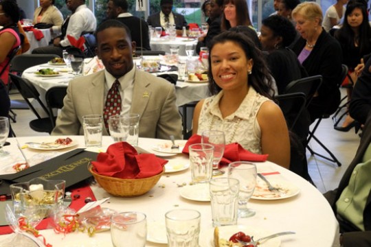People eating at table at event