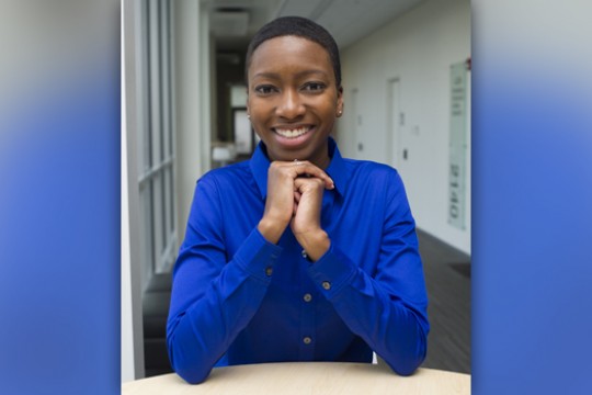 Person posing for camera at table