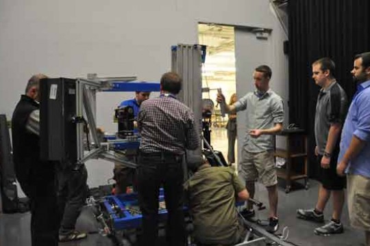 People building machine