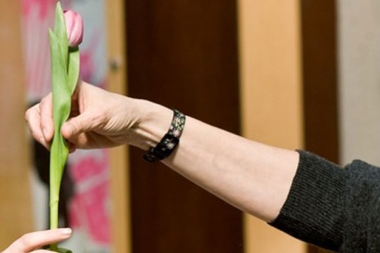 Person placing flower