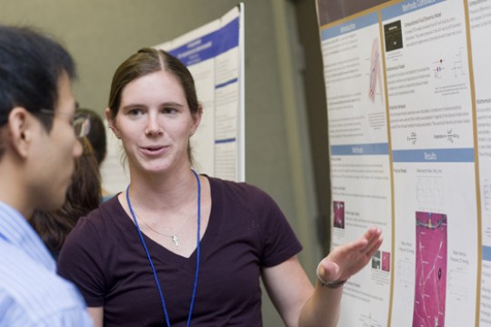 Student explaining presentation to someone