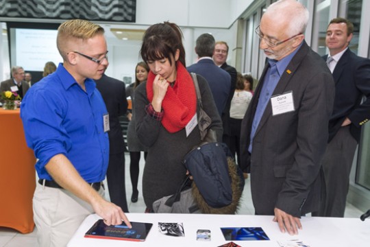 Person explaining product to people