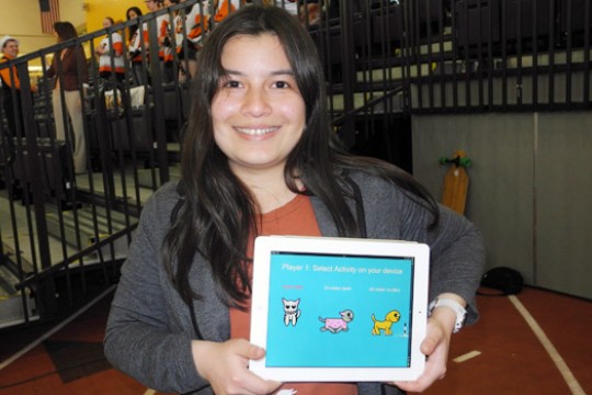 Person holding tablet displaying three animals
