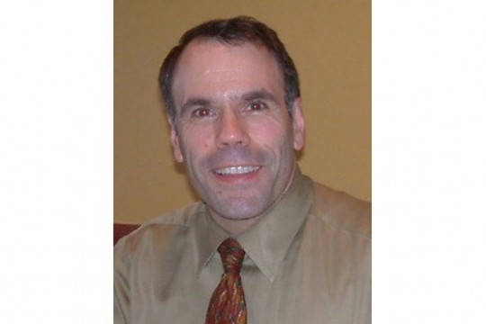 Professor posing for camera