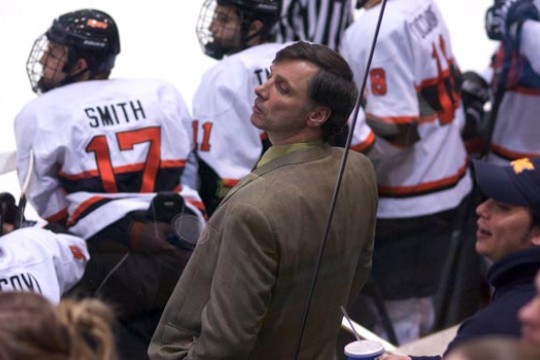 Coach with RIT hockey players