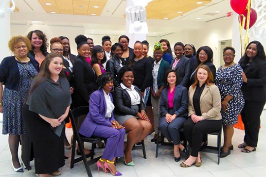 group of multicultural women posing for a photo.