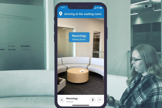 Graphic of woman sitting in waiting room in background with image of smartphone screen in foreground