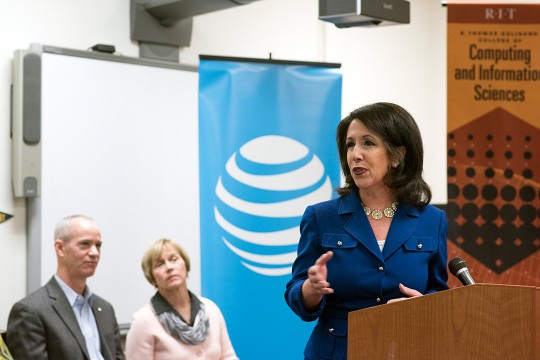 Woman speaks at podium 