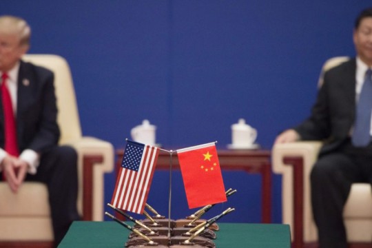 Shot of small American and Chinese flags.