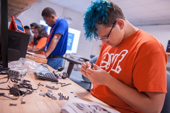 Student works with Lego pieces.