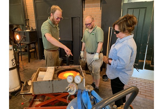 Three glassblowers work at the Henry Ford Museum.