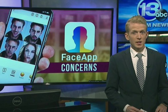 Screenshot of TV anchor standing next to monitor displaying image of cellphone and the words FaceApp Concerns.