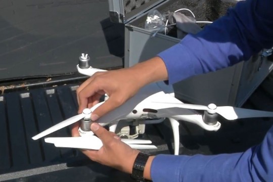 Student assembles drone.