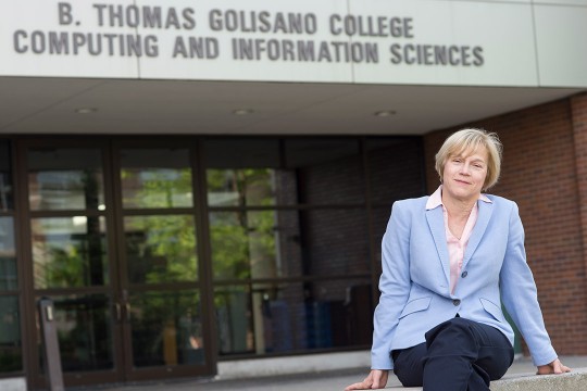 Anne Haake sits outside of computing building.