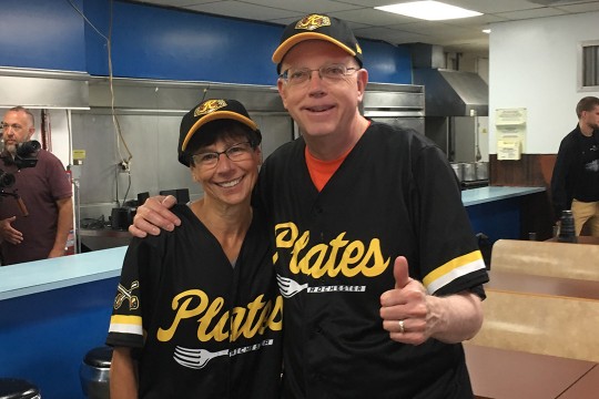President Munson and wife wearing "Plates" baseball shirts.