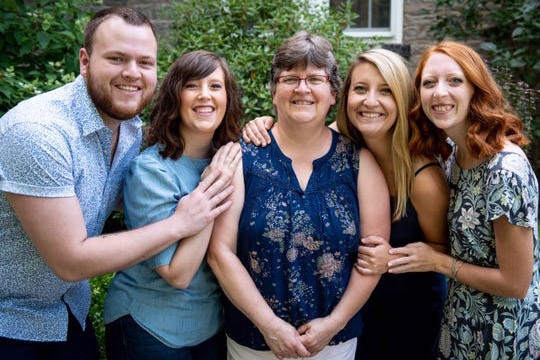 Deaf social worker Patricia Canne pictured with her family.