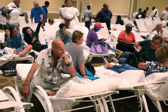 Survivors of Hurricane Matthew in 2016 spent the night on beach chairs in a ballroom at the Melia Hotel in Nassau.