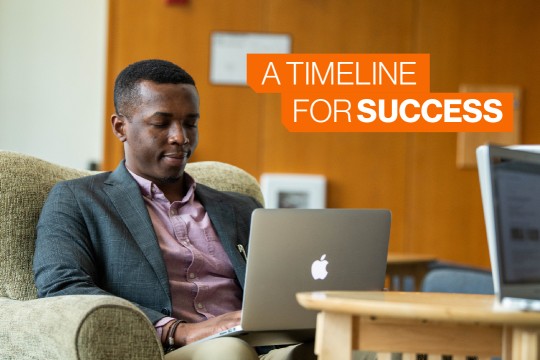 A Saunders student works on his laptop. 