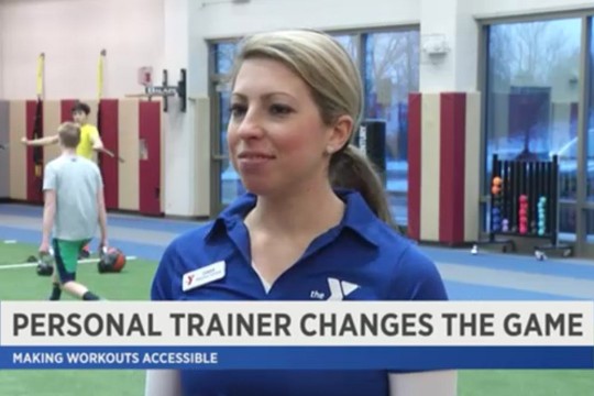 trainer at YMCA gym with text: Personal trainer changes the game: making workouts accessible.