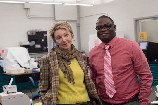 two people standing in lab.