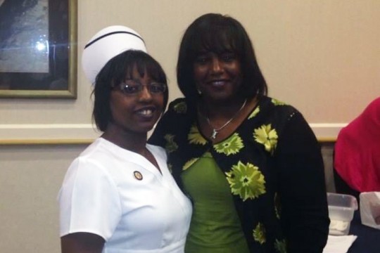 two women standing next to each other.