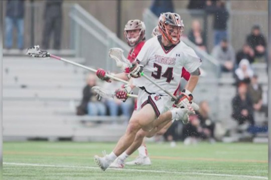 men's lacrosse player in action.