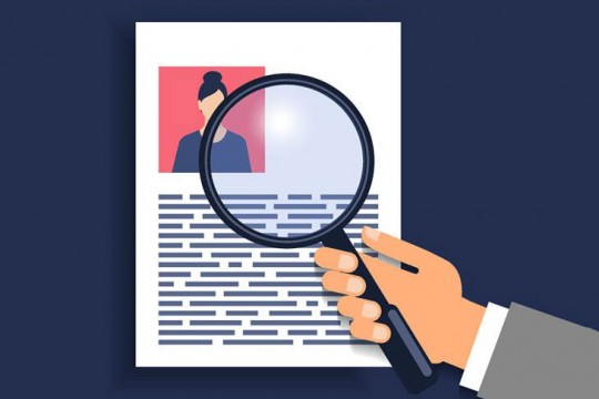 illustration of hand holding a magnifying glass over a resume.