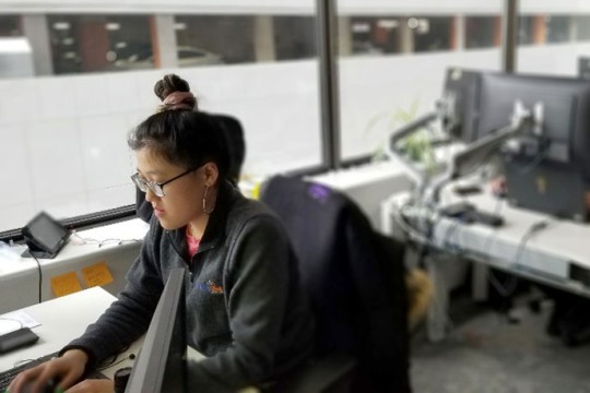 student working on a computer in a lab.