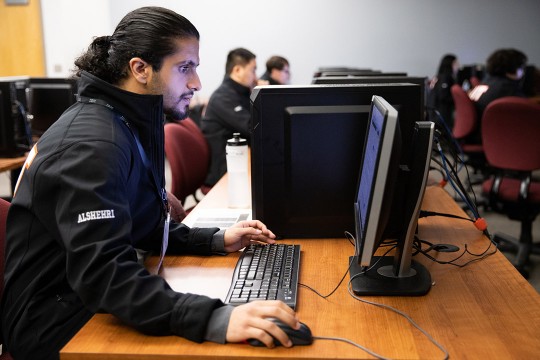 student using a desktop computer.