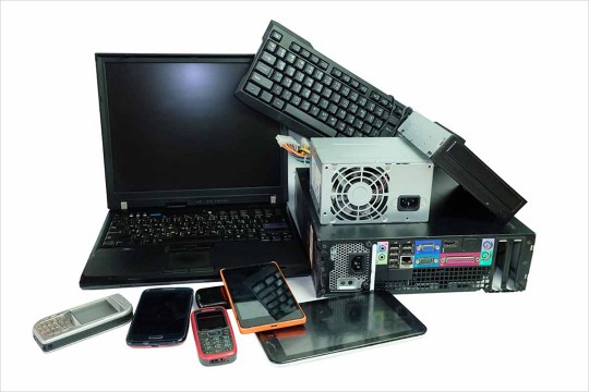 a pile of old electronic devices.