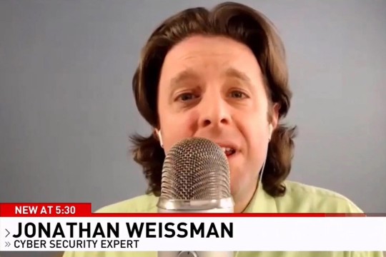 professor talking into a microphone.