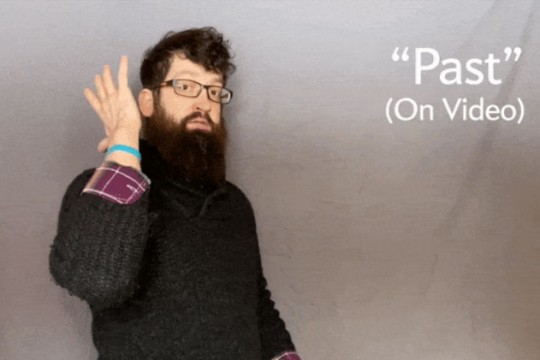 person demonstrating the ASL word for "past" when videoconferencing.