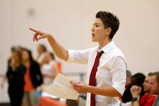 women's basketball coach calling out a play.