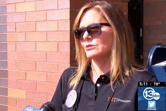 RIT administrator being interviewed on TV.