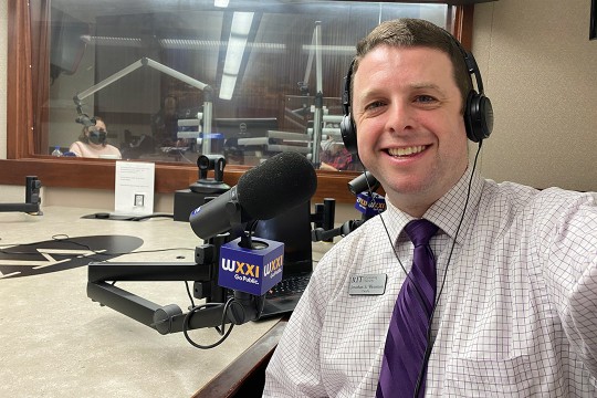 professor in a radio studio.